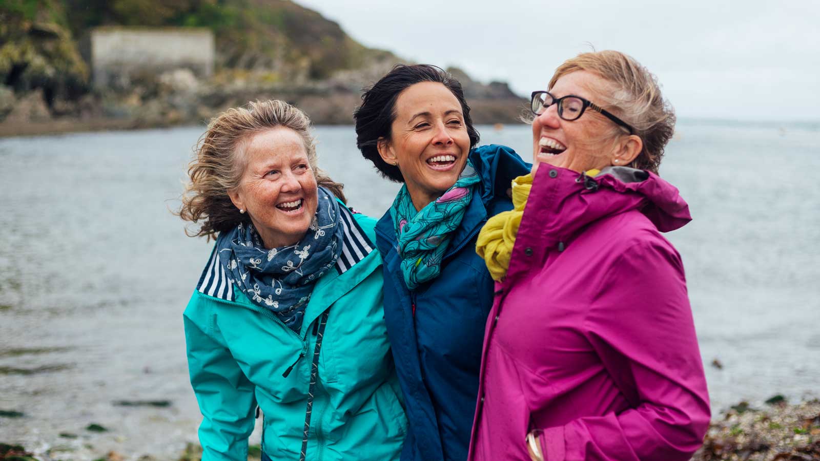 Group of women outdoors promoting colon cancer awareness and screening.
