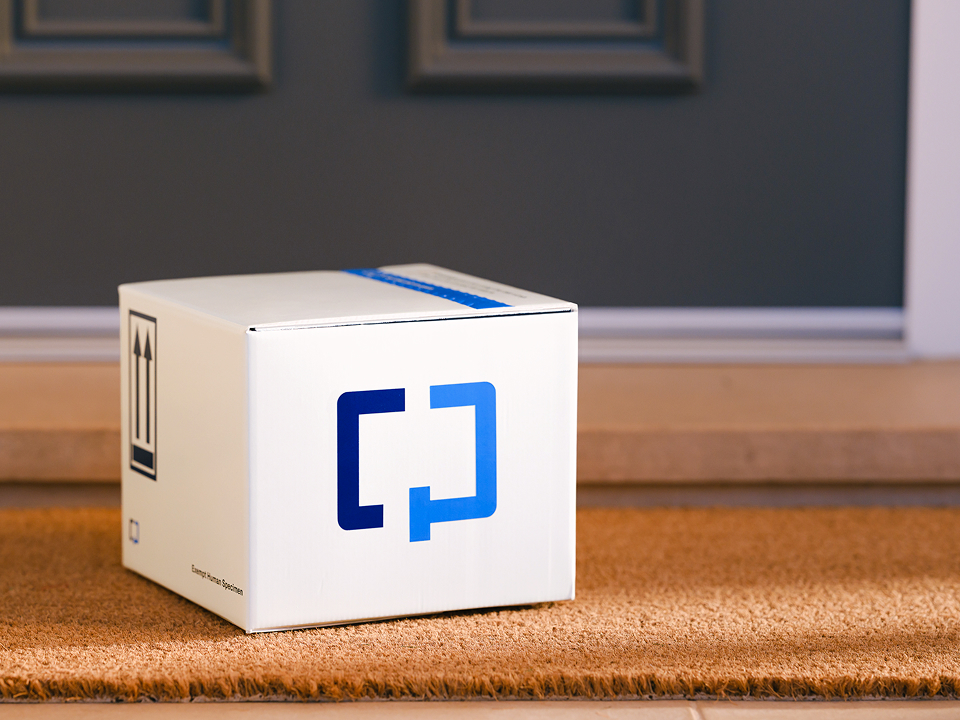  A Cologuard Plus box by a front door.