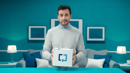 A man holding a Cologuard test box