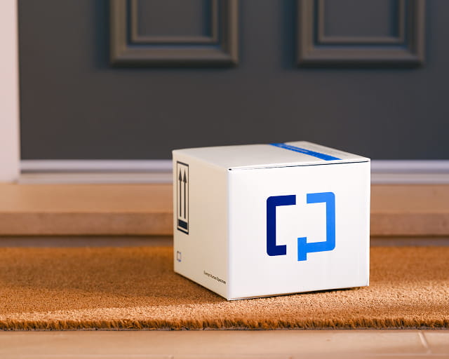  A Cologuard Plus box by a front door.